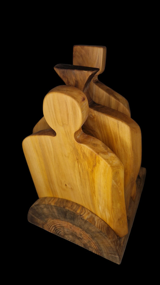 Handcrafted live edge Applewood charcuterie board with warm orange and brown wood tones.