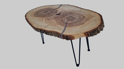 Wooden coffee table with a natural finish on a textured surface