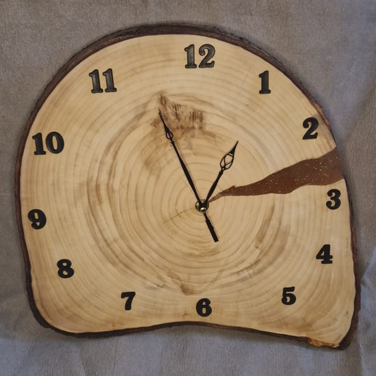 Handcrafted irregular Aspen wood slice wall clock showing natural raw edges and satin-like grain.