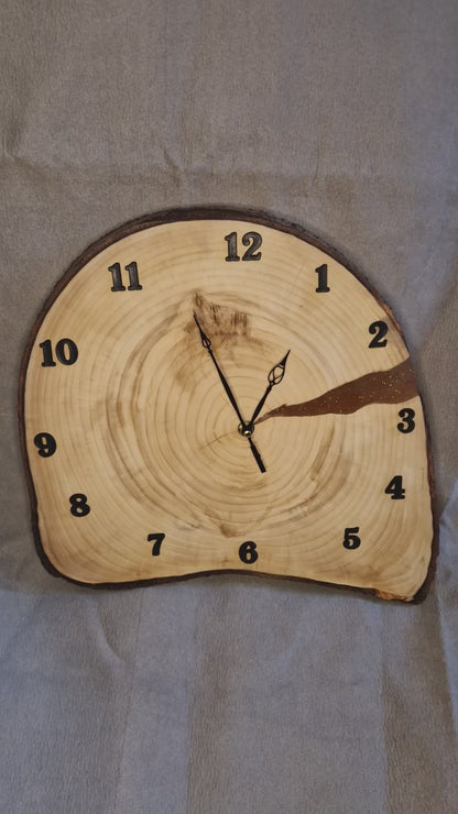 Handcrafted irregular Aspen wood slice wall clock showing natural raw edges and satin-like grain.