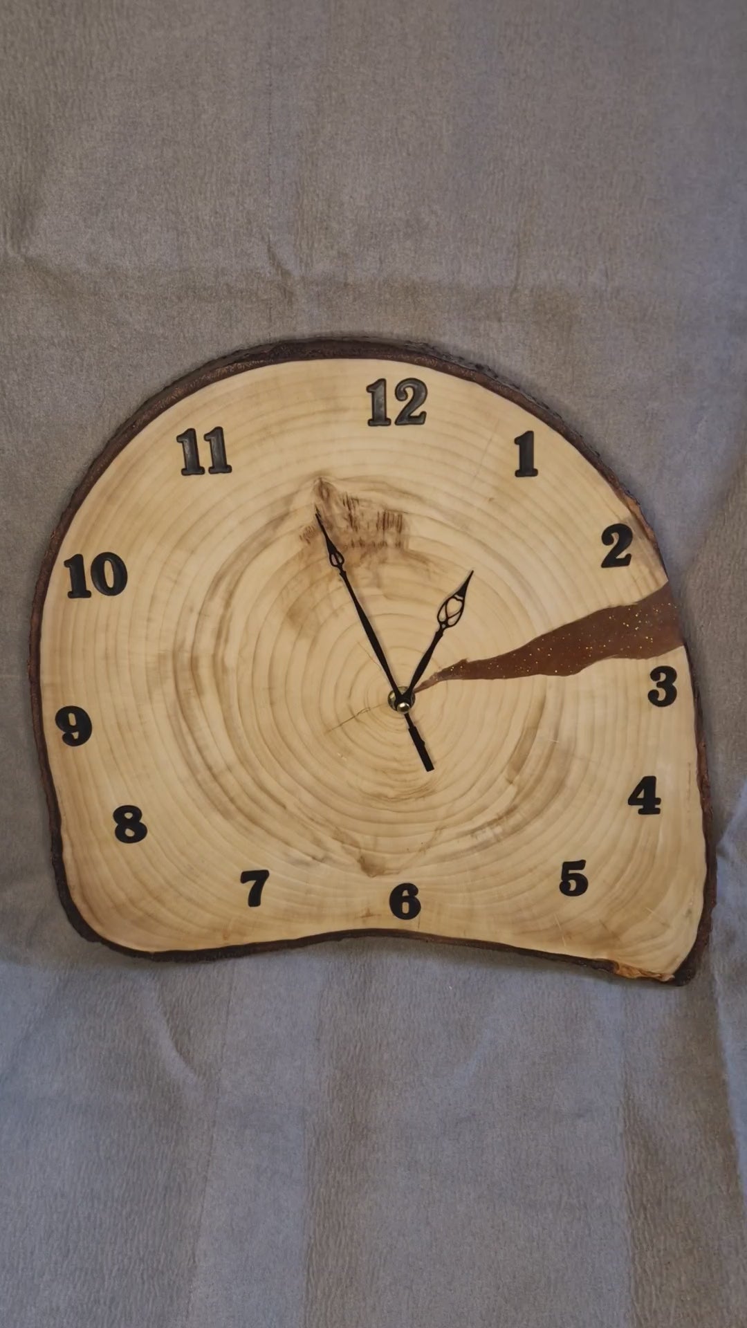 Handcrafted irregular Aspen wood slice wall clock showing natural raw edges and satin-like grain.