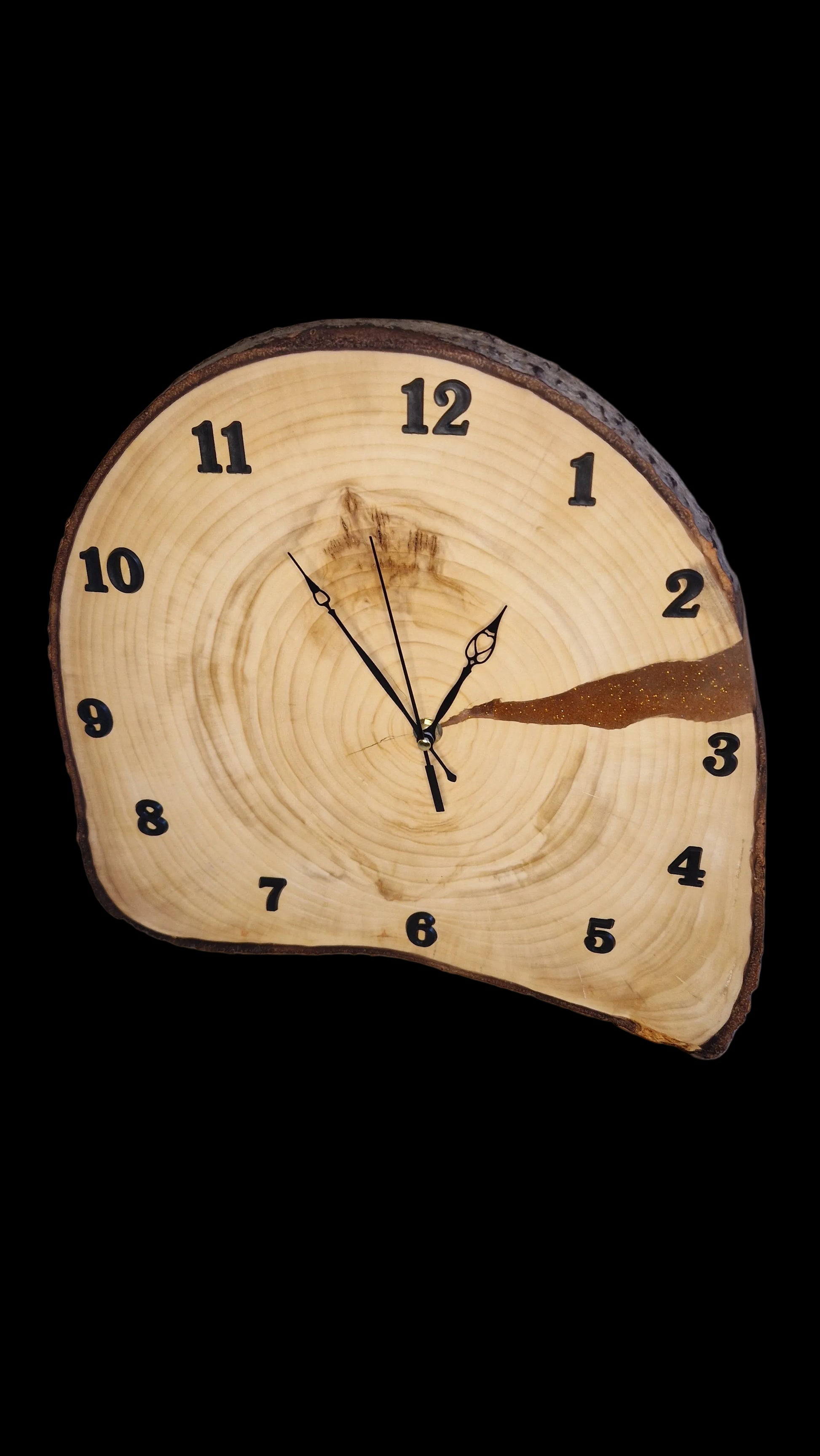 Handcrafted irregular Aspen wood slice wall clock showing natural raw edges and satin-like grain.