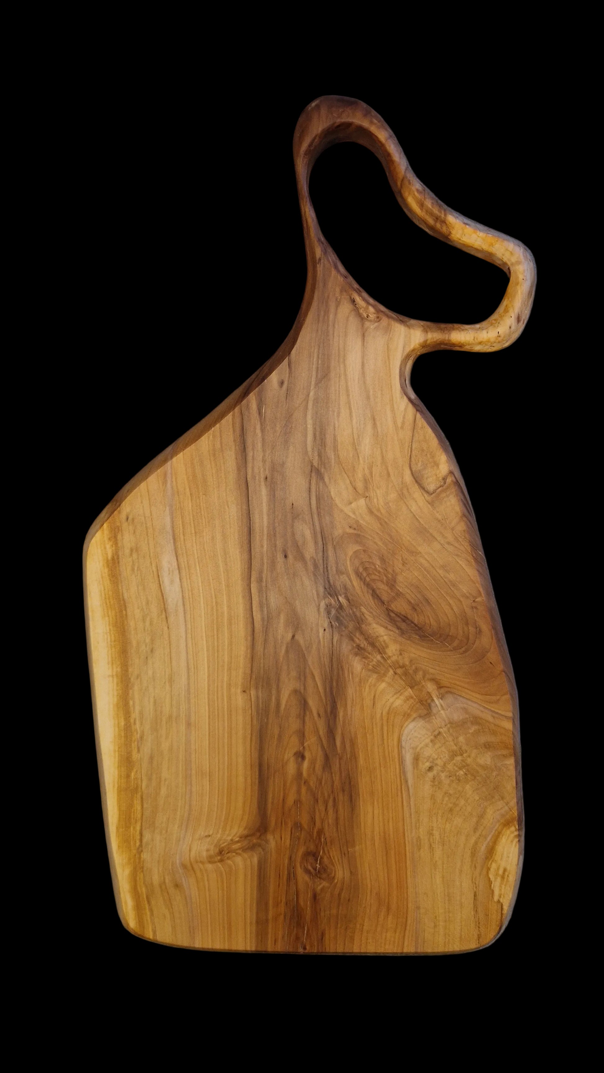 Handcrafted live edge Applewood charcuterie board with warm orange and brown wood tones.