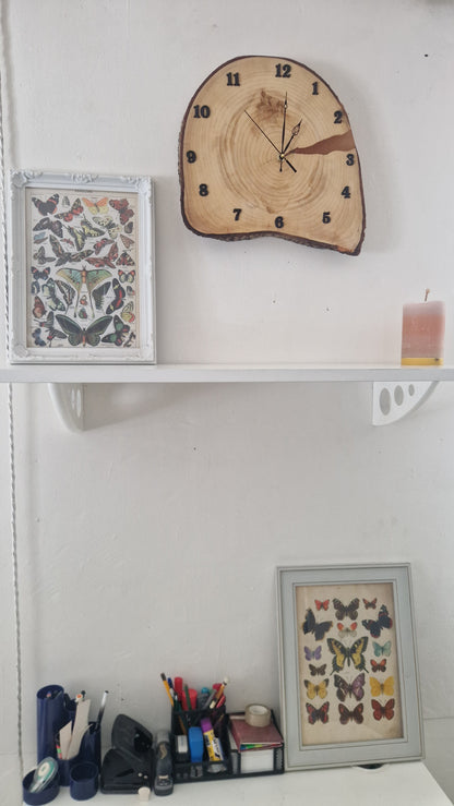 Wooden clock and decorative items on a shelf