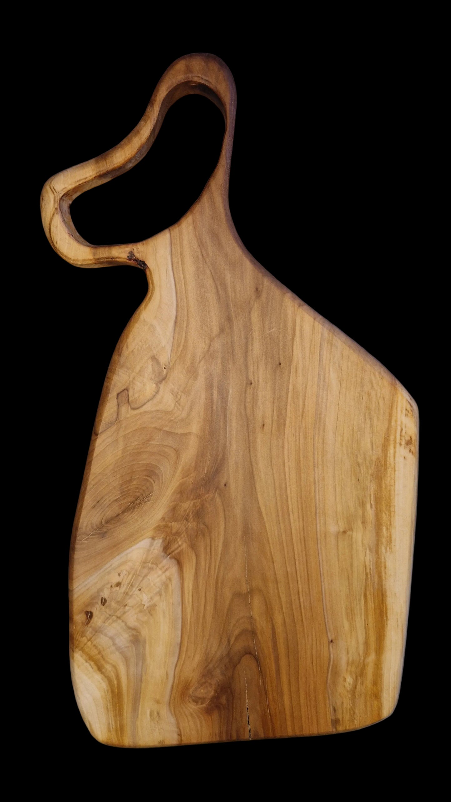 Handcrafted live edge Applewood charcuterie board with warm orange and brown wood tones.